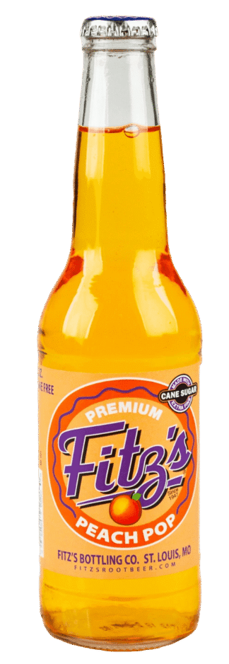 Fizzy orange soda in glass bottle