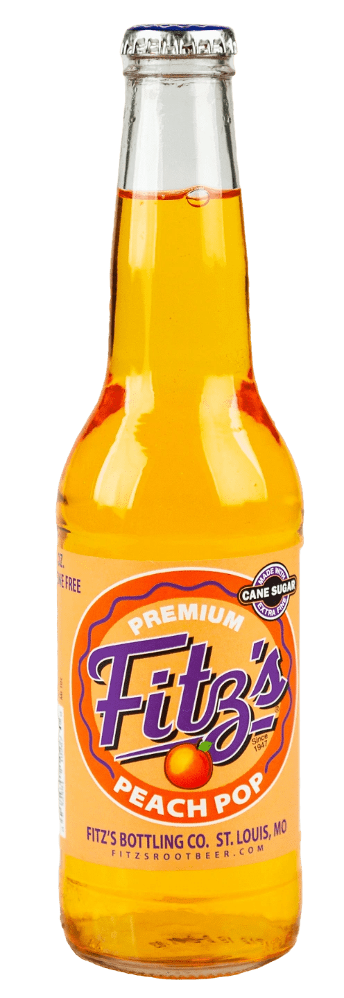 Fizzy orange soda in glass bottle