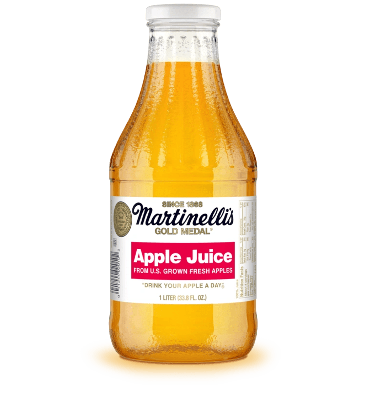 Clear bottle of apple juice upright