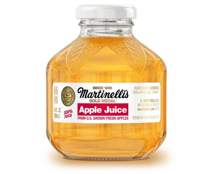 Martinelli's apple juice on black background