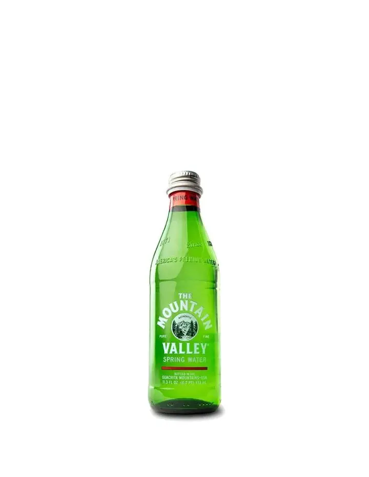 Small Mountain Valley green glass bottle