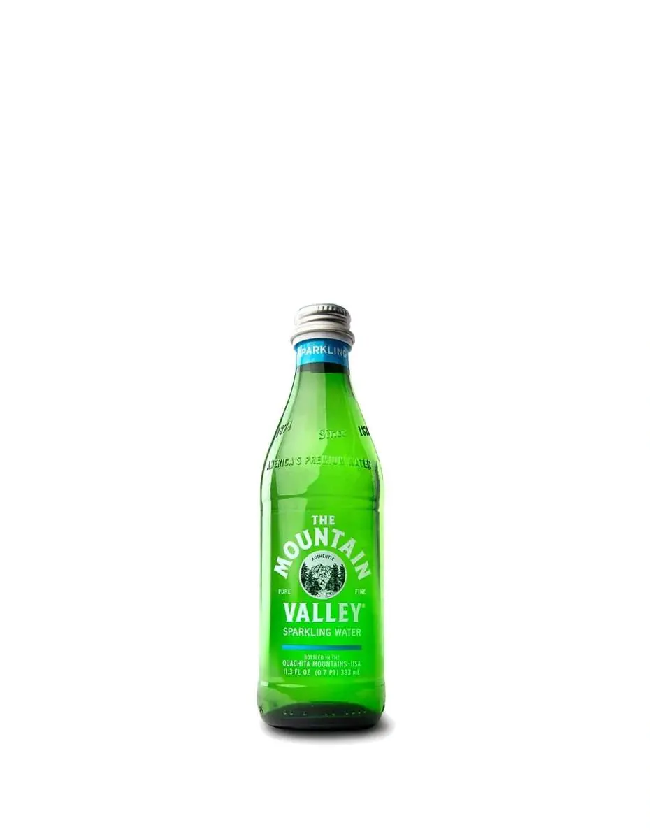 Sparkling water in a green bottle