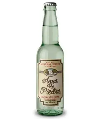 Green glass bottle of sparkling mineral water