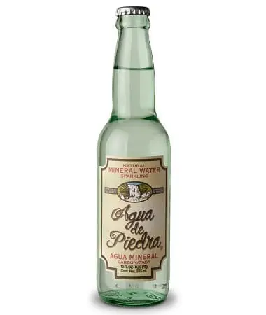 Green glass bottle of sparkling mineral water