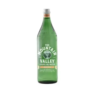 Green glass bottle of white peach water