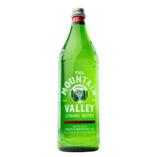 Mountain Valley green glass spring water bottle