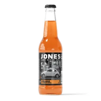 A bottle of Jones Orange Cream Soda with a vintage car label.