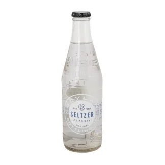 Clear glass seltzer bottle with label