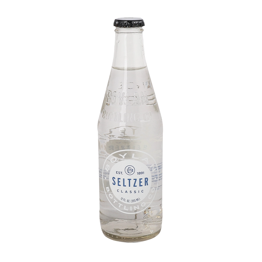 Clear glass seltzer bottle with label