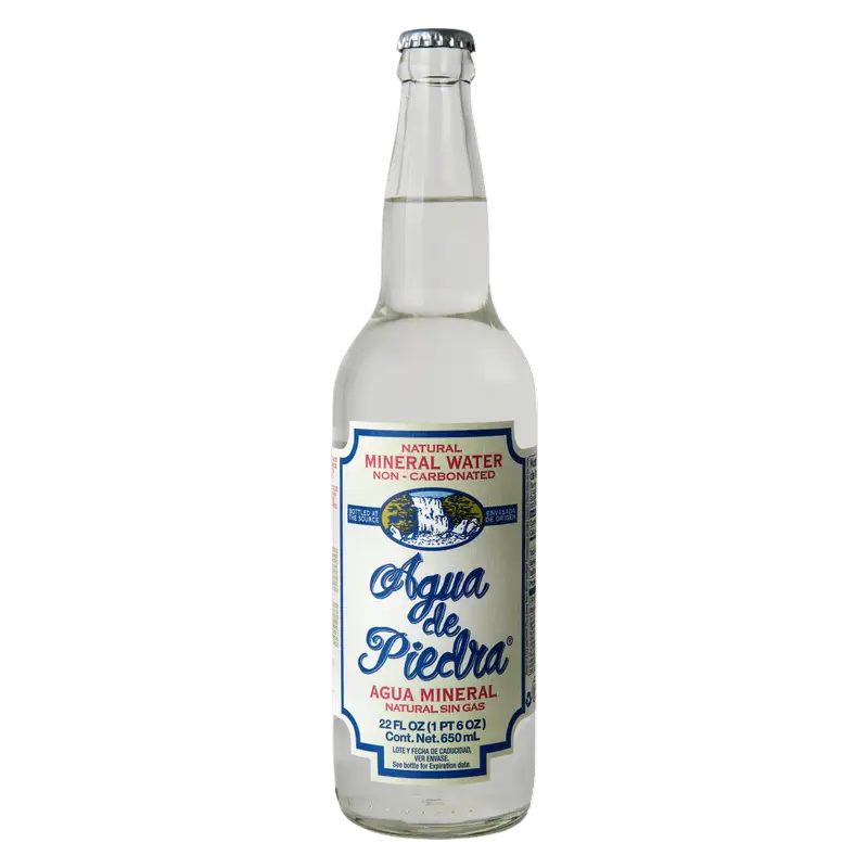Clear glass bottle of mineral water